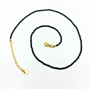 Collana in acciaio dorato con cristallo nero