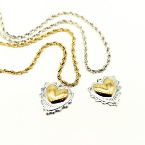 Alternative view of Ciondolo cuore sacro acciaio bicolor