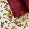 Abbinamento ottone e Bobina Filo Cerato Linhasita 0,75 mm 228 mt Bordeaux